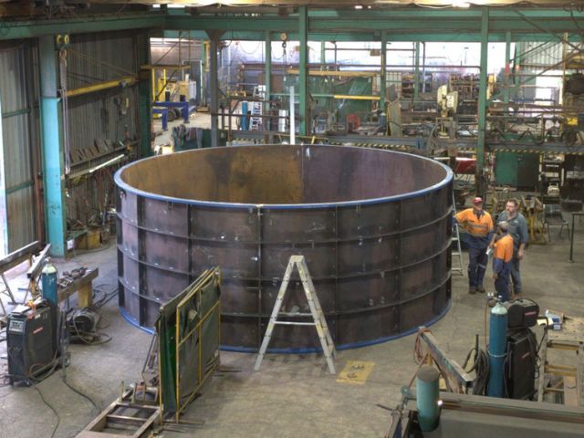 Custom pumpwell formwork for sewage. Fabricated steel part on fabricators shop floor.