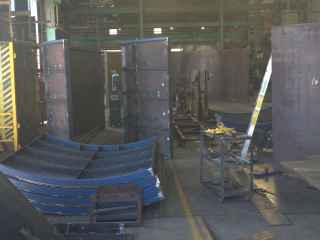 Custom pumpwell formwork for sewage. Fabricated steel part on fabricators shop floor.