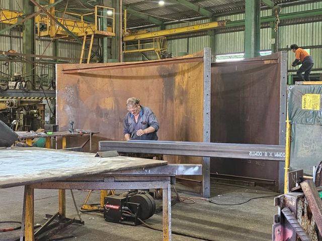 Custom pumpwell formwork for sewage. Fabricated steel part on fabricators shop floor.