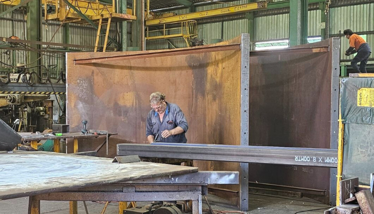 Boilermaker working on custom steel formwork project