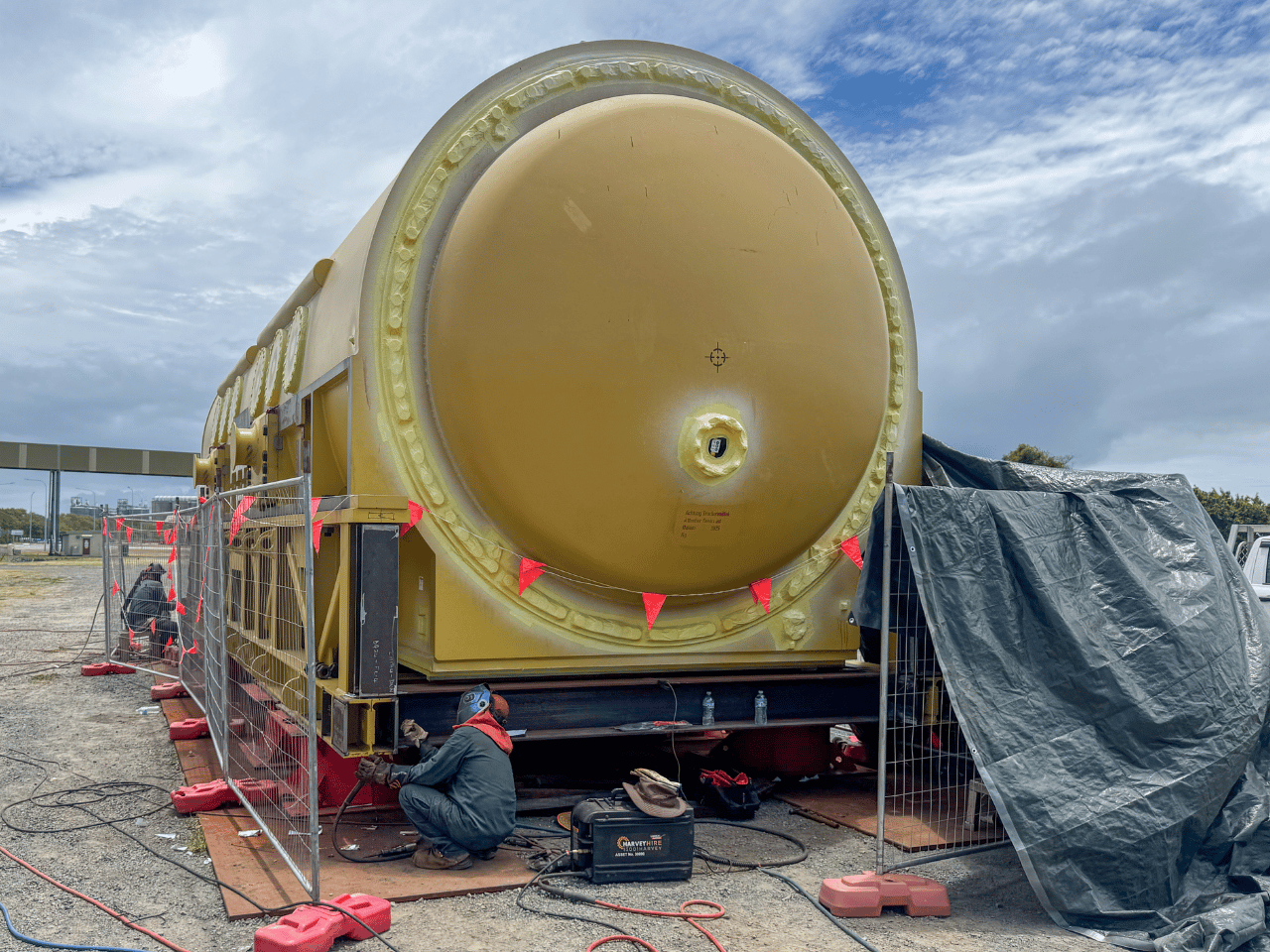 Boilermaker carrying out on-site welding to a transport frame for a generator stator