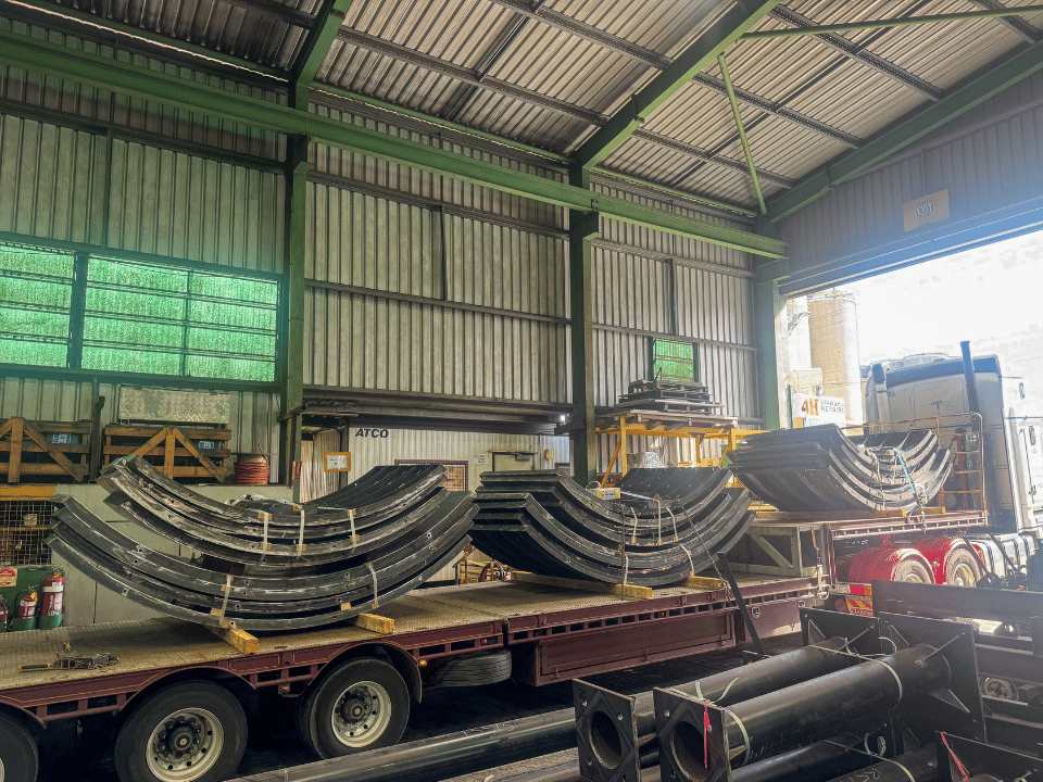Transporting steel formwork sections on trailer for site delivery