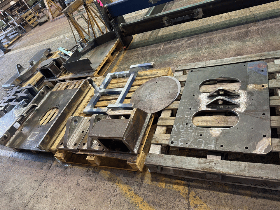 Mining liner handler fabrication showing fabricated structural steel plates, brackets and assembly components prepared in DWW Engineering’s workshop